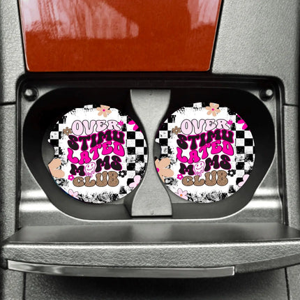 a pair of car coasters with a checkered design